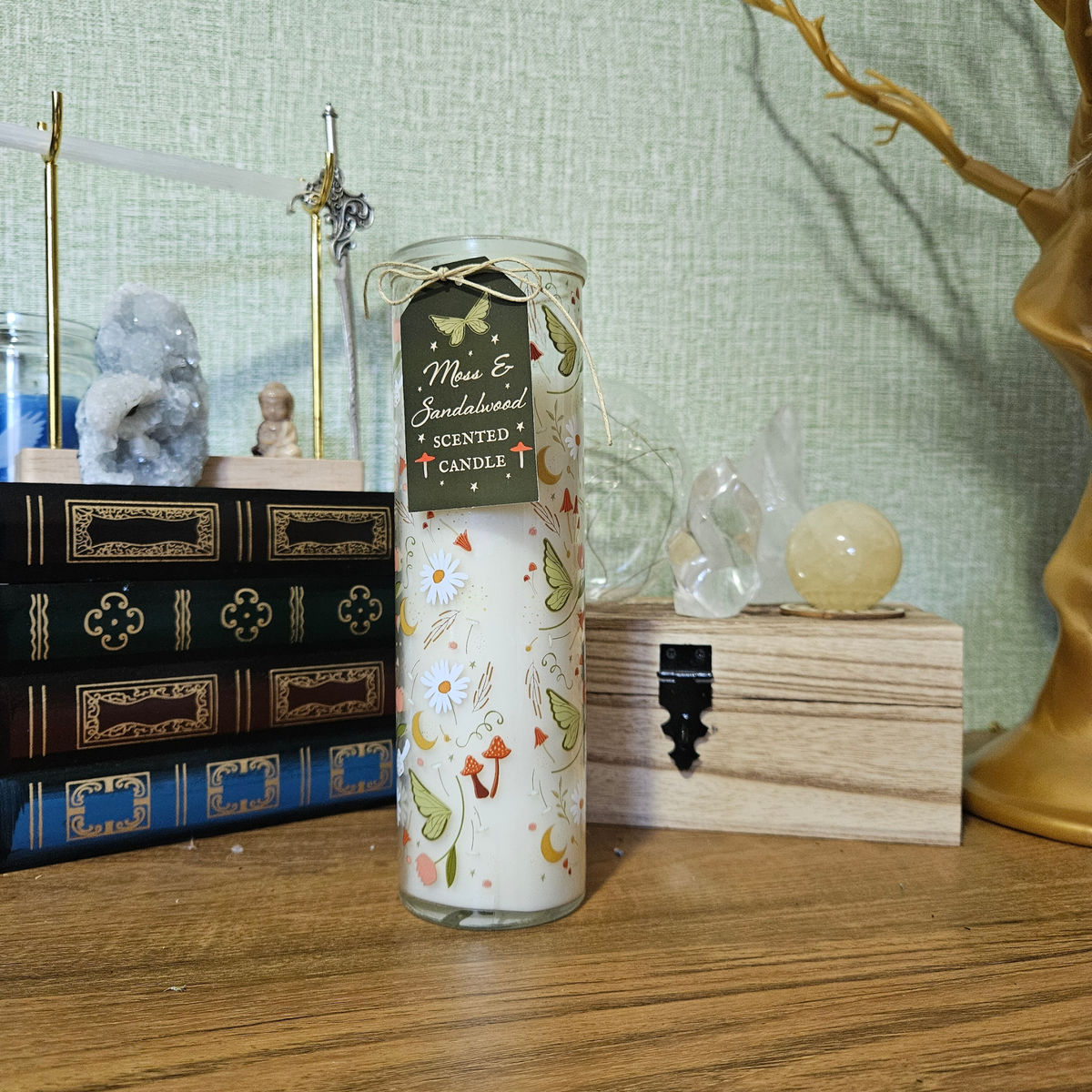Moss and Sandalwood scented pillar candle in glass decorated with mushrooms, moths, crescent moons, daisies and woodland illustrations.