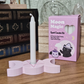 Pink Moon Magic spell candle kit with 12 white protection candles and pink triple moon candle holder.