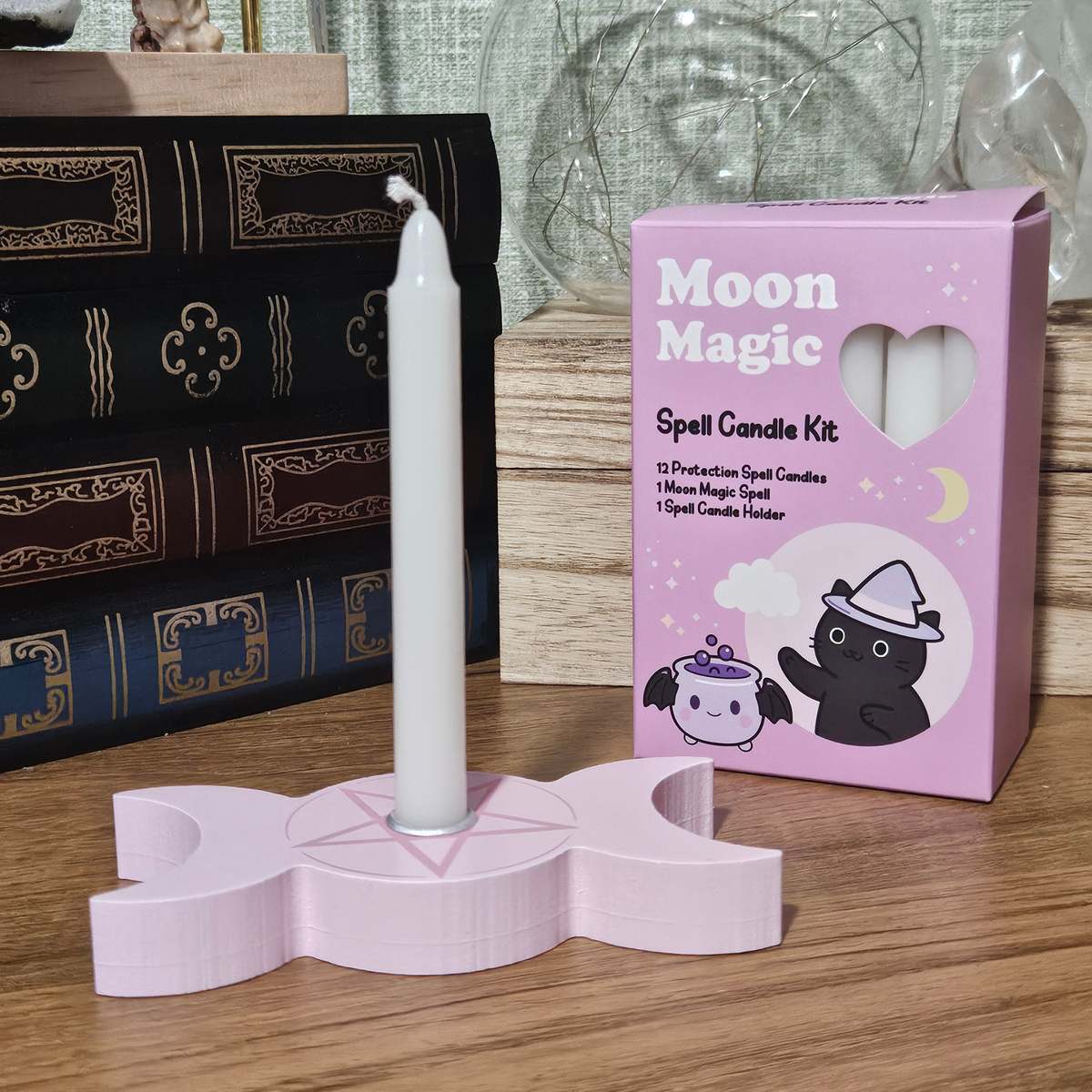 Pink Moon Magic spell candle kit with 12 white protection candles and pink triple moon candle holder.