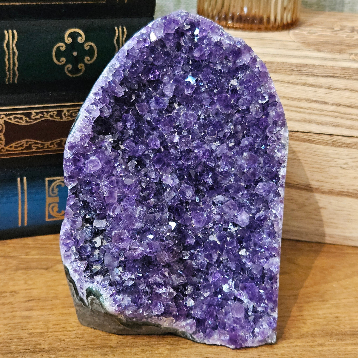 Uruguayan amethyst druze crystal cluster with polished edges and a freestanding cut base, weighing 695g