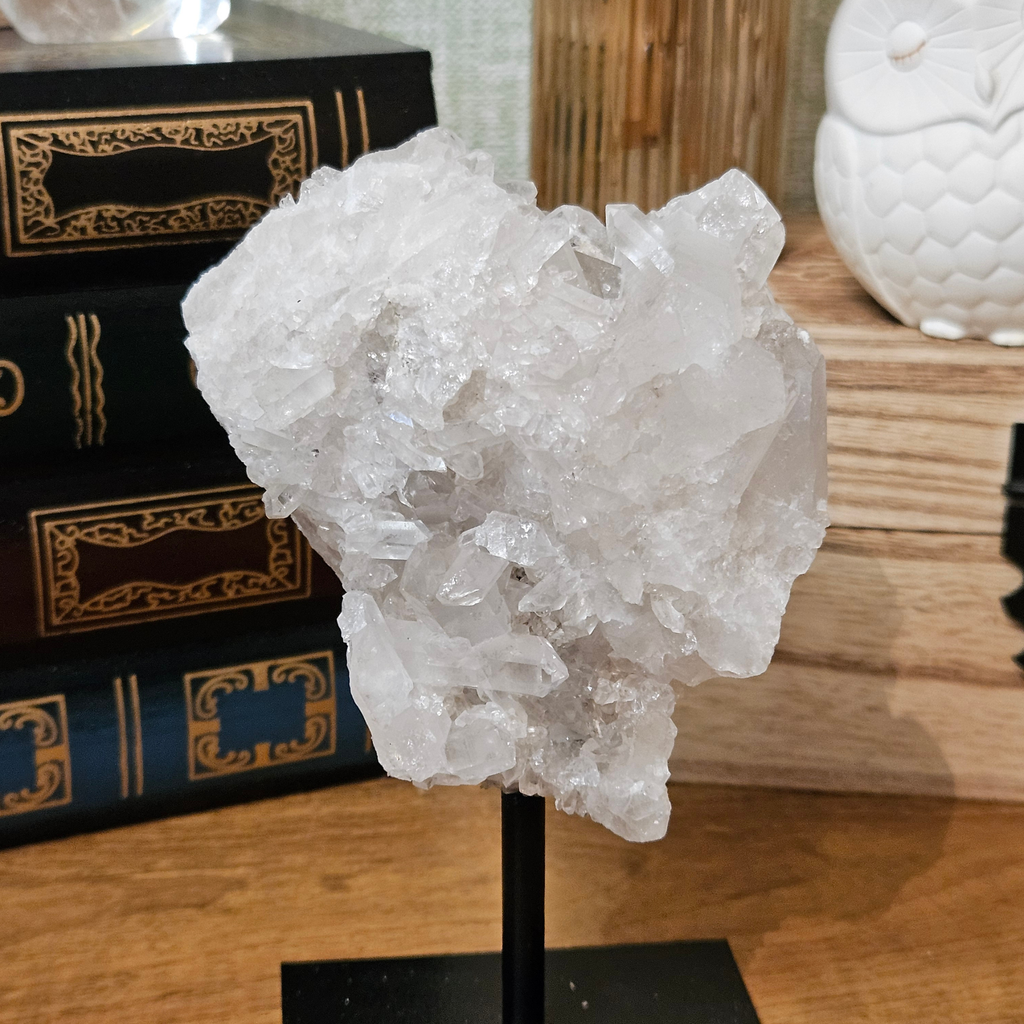 Close-up of natural quartz druze crystals showing delicate crystalline formations and textured mineral surface