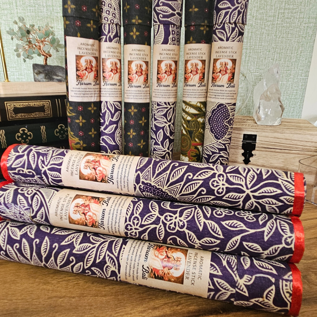 Lavender aromatic incense sticks in assorted decorative fabric-covered tubes.