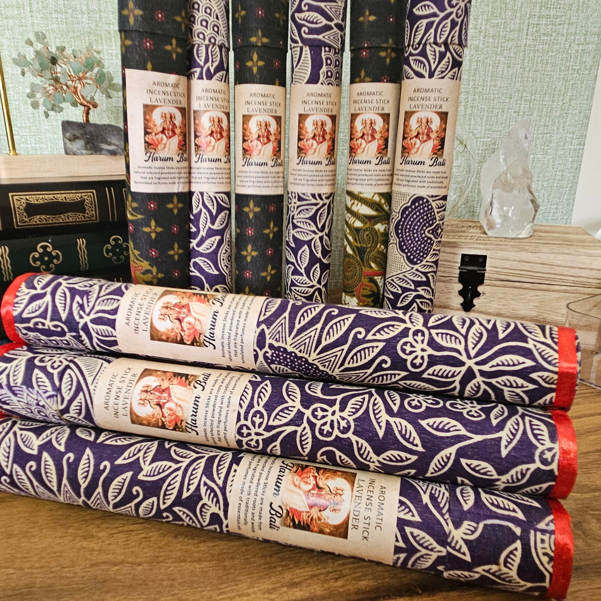 Lavender aromatic incense sticks in assorted decorative fabric-covered tubes.