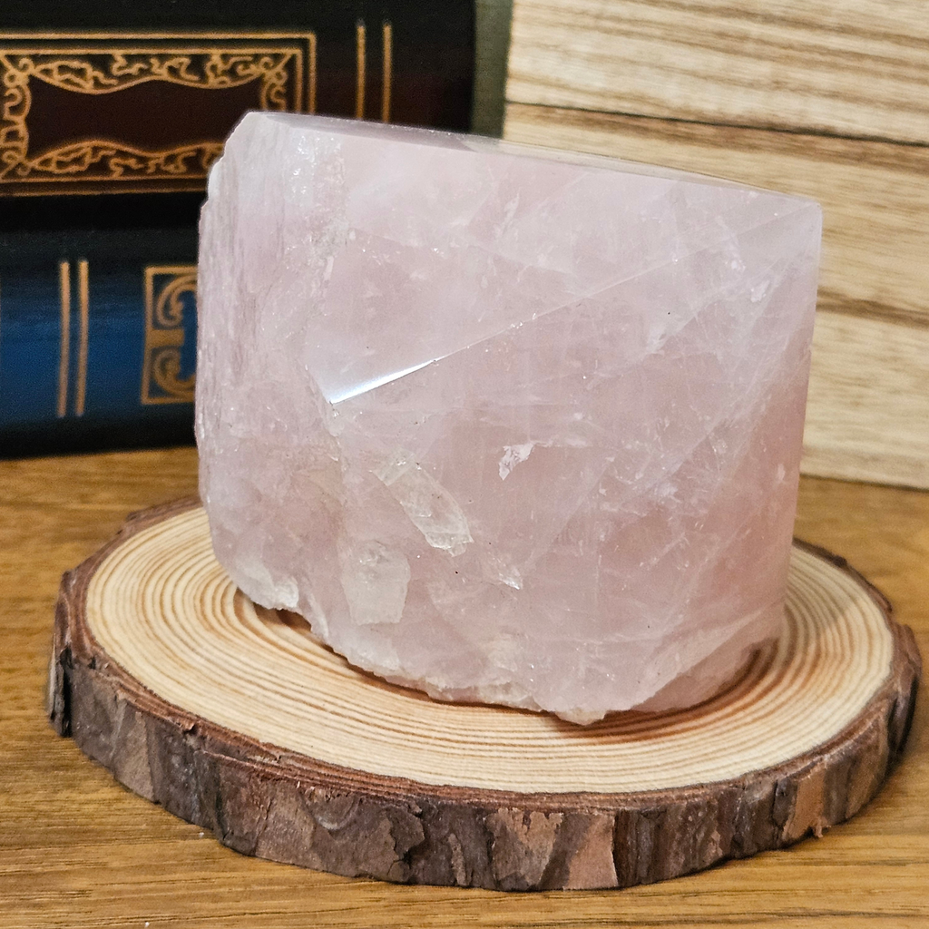 Large Madagascan rose quartz freeform crystal with polished pink upper surface and natural rough stone base