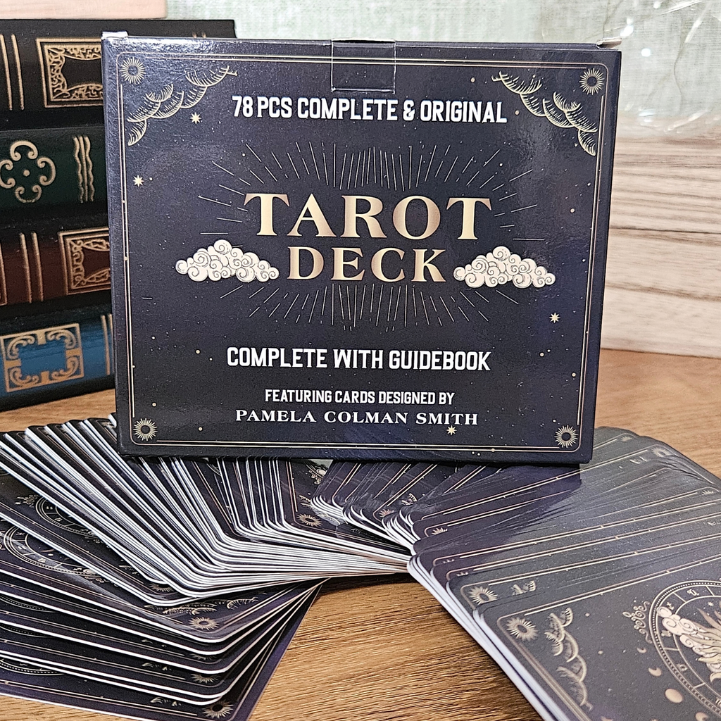 Complete 78-card tarot deck with guidebook and black celestial moon and star card design.