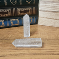 Natural A Grade clear quartz crystal tower with polished pointed tip and translucent crystalline appearance