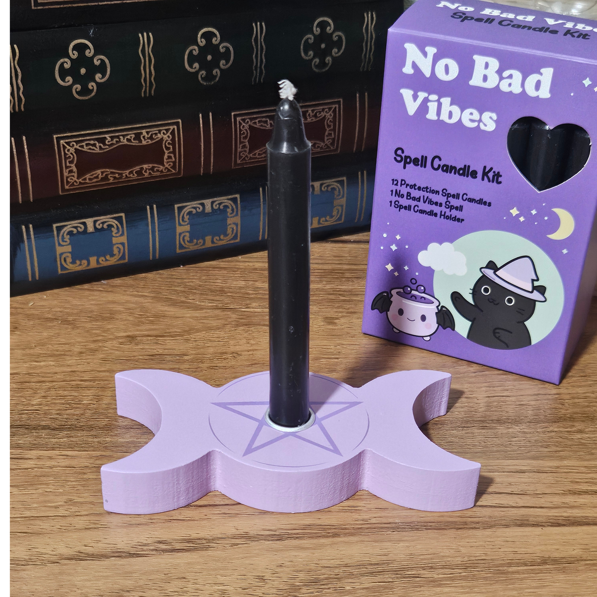 No Bad Vibes Spell Candle Kit with black protection candle and triple moon candle holder.
