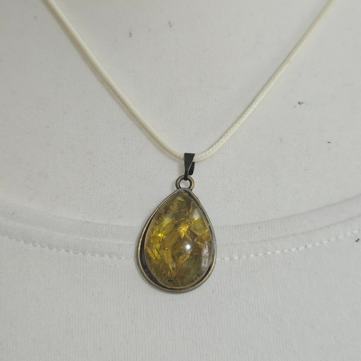 Handmade Citrine crystal chip pendant necklaces set in resin within decorative metal bezels in a choice of designs.