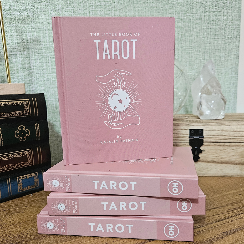 Pink hardback copy of The Little Book of Tarot by Katalin Patnaik.