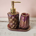 Purple and antique gold handmade resin soap dispenser and tumbler on matching glitter tray