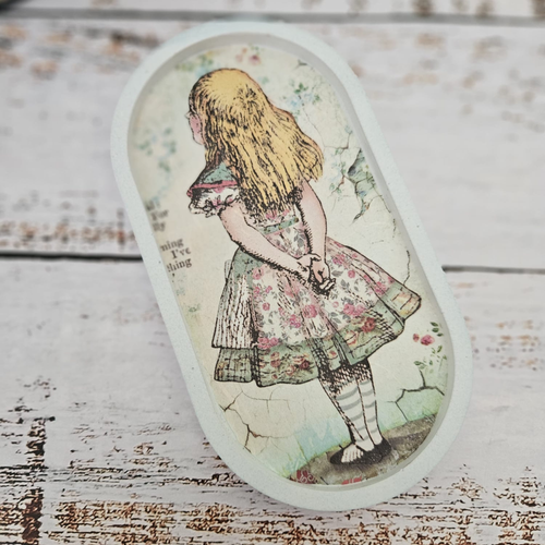Alice in Wonderland handmade trinket tray styled with jewellery, vintage key and teacup