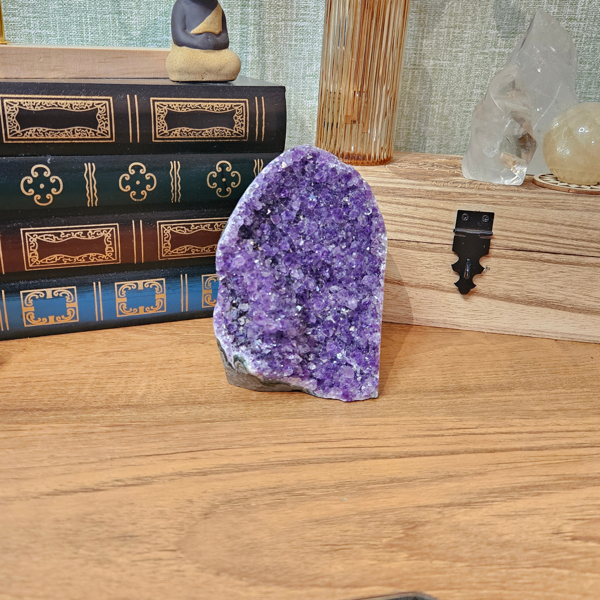 Natural amethyst crystal specimen with sparkling purple crystal points and polished mineral edges