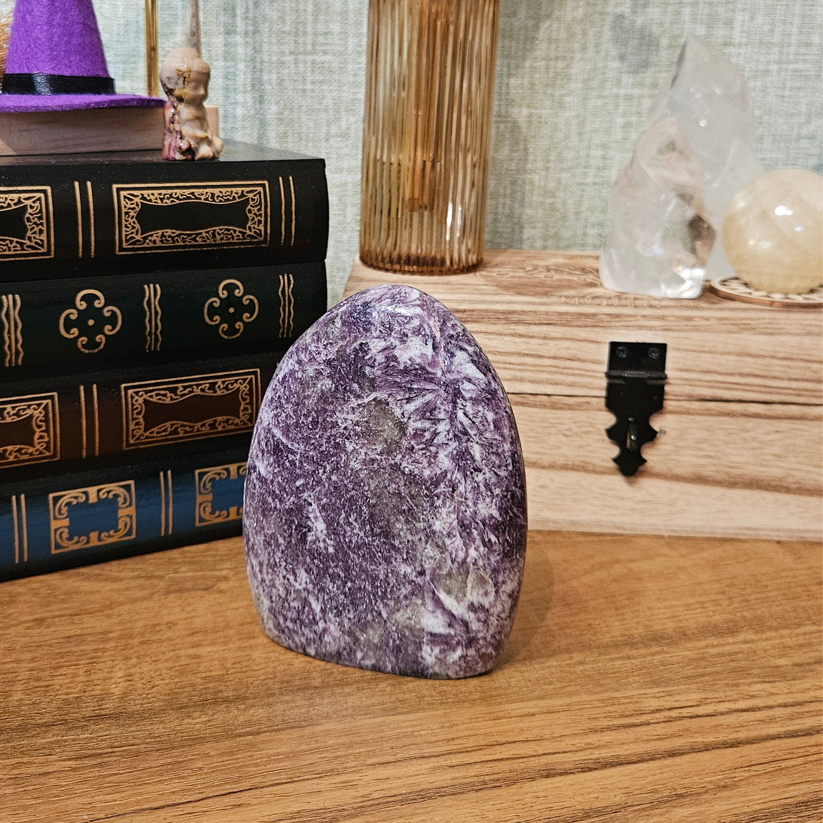 Madagascan lepidolite freeform crystal showing polished stone surface and natural mineral variations