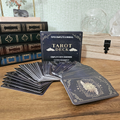 Complete 78-card tarot deck with guidebook and black celestial moon and star card design.