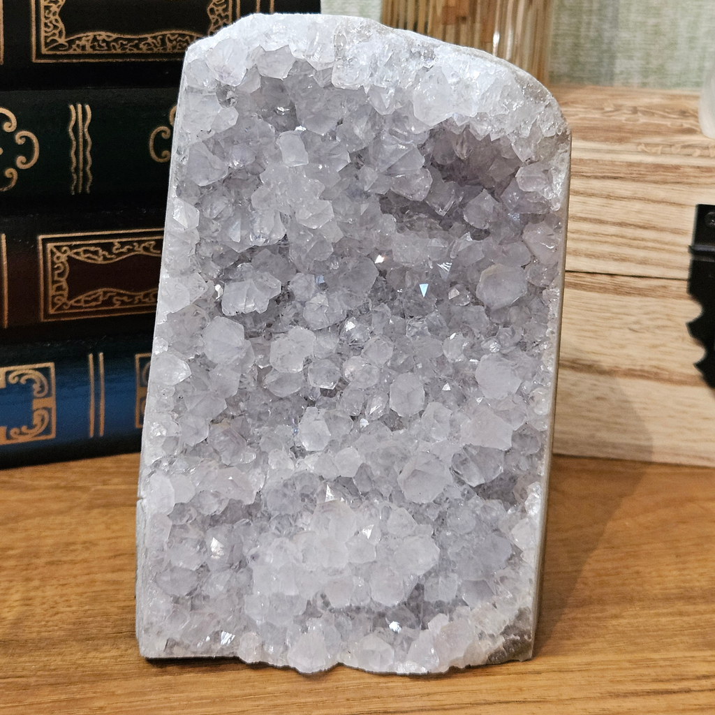 Close-up of natural amethyst quartz cluster showing purple crystal points and textured formations