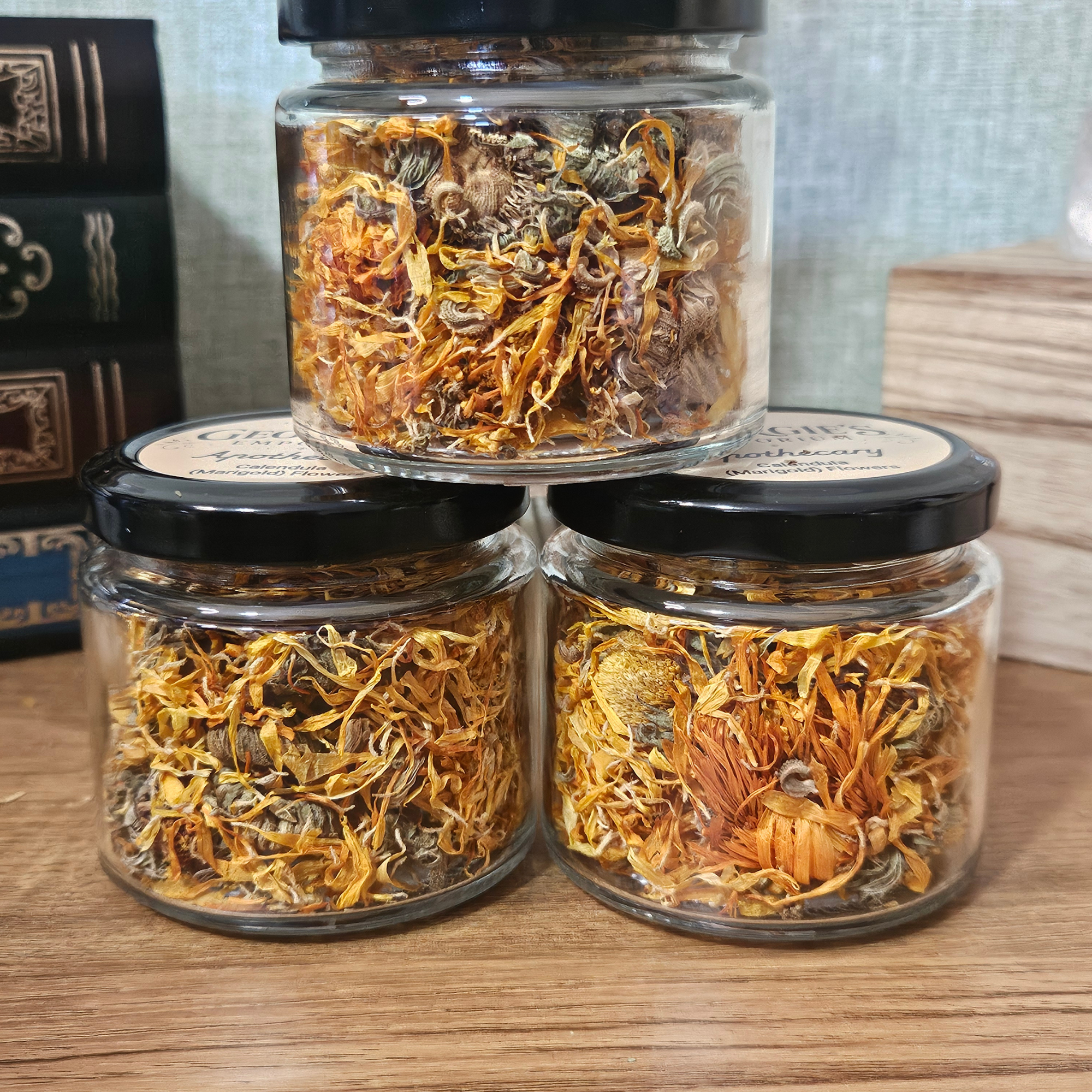 Dried golden Calendula Marigold flowers in a reusable glass botanical jar