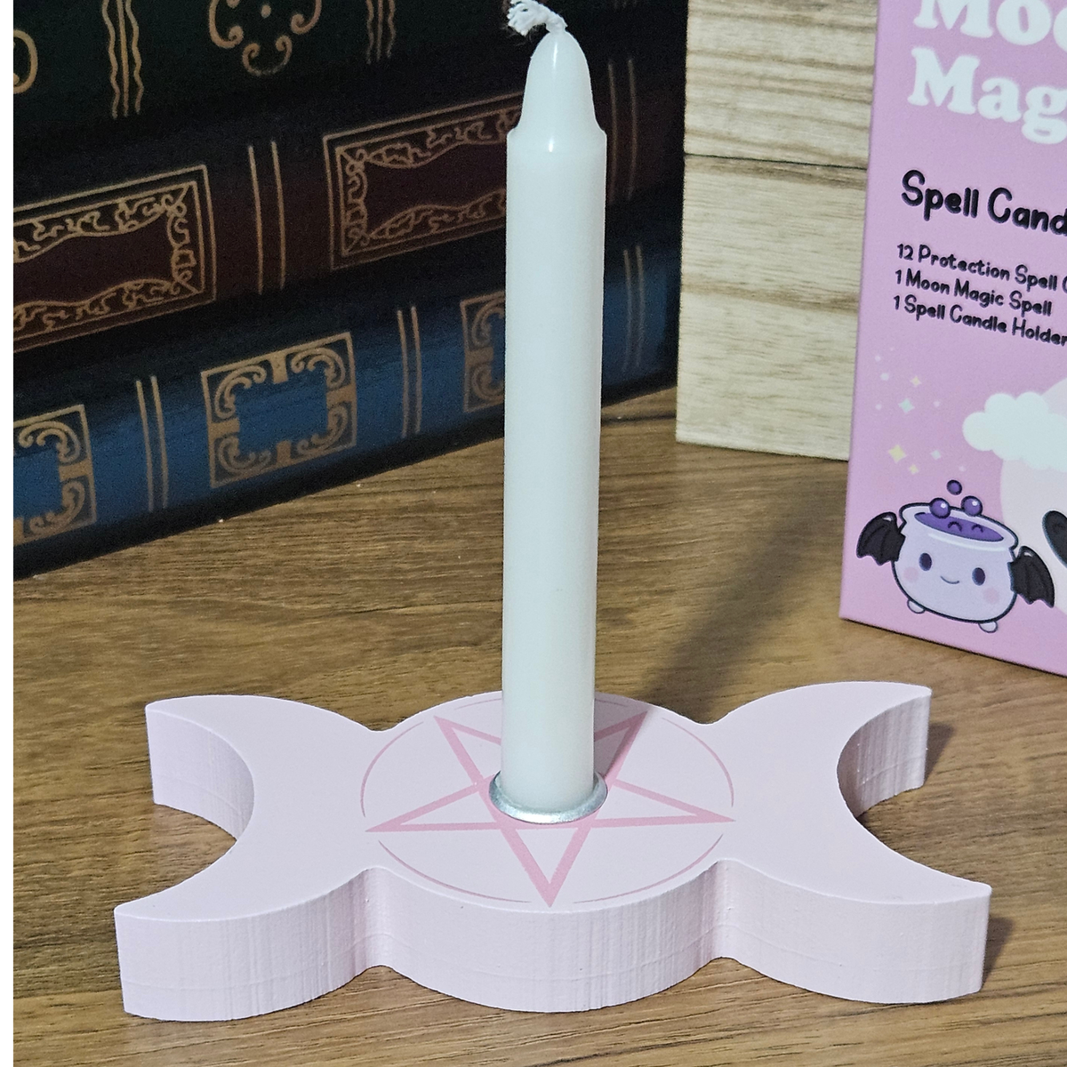 Pink Moon Magic spell candle kit with 12 white protection candles and pink triple moon candle holder.