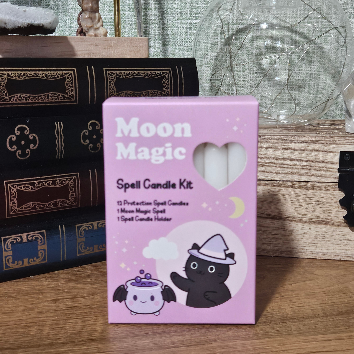 Pink Moon Magic spell candle kit with 12 white protection candles and pink triple moon candle holder.