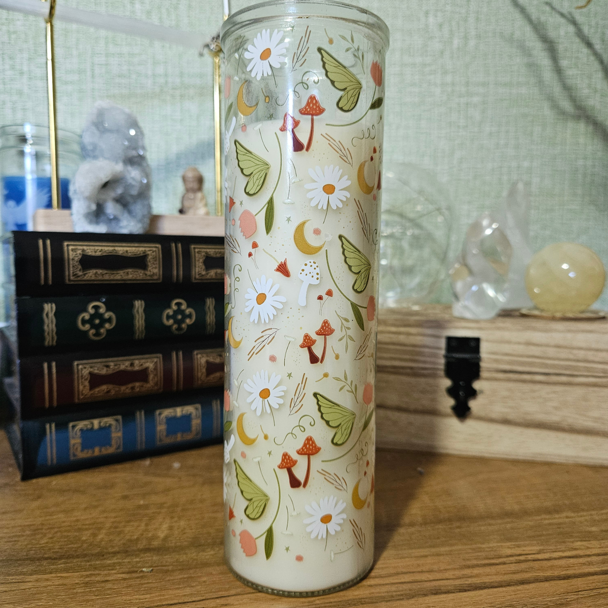 Moss and Sandalwood scented pillar candle in glass decorated with mushrooms, moths, crescent moons, daisies and woodland illustrations.
