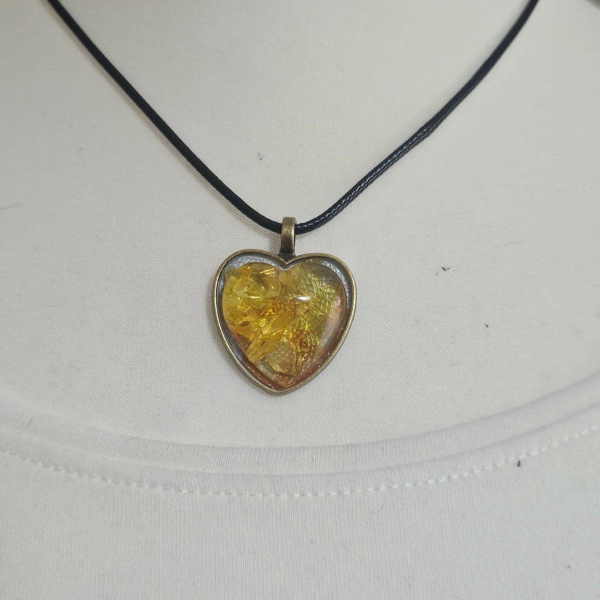 Handmade Citrine crystal chip pendant necklaces set in resin within decorative metal bezels in a choice of designs.