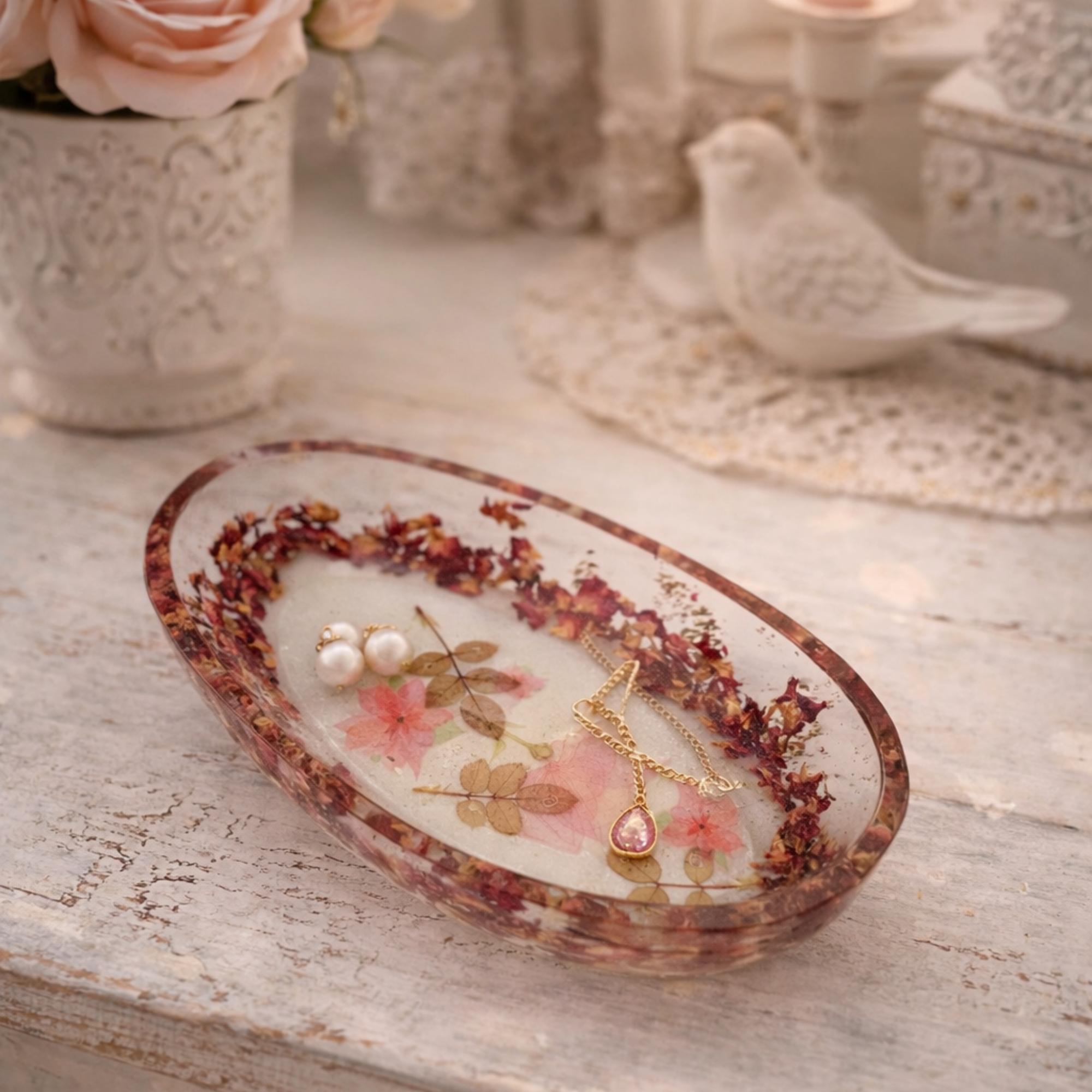 Handmade botanical resin trinket bowl styled with pearl earrings and gold necklace