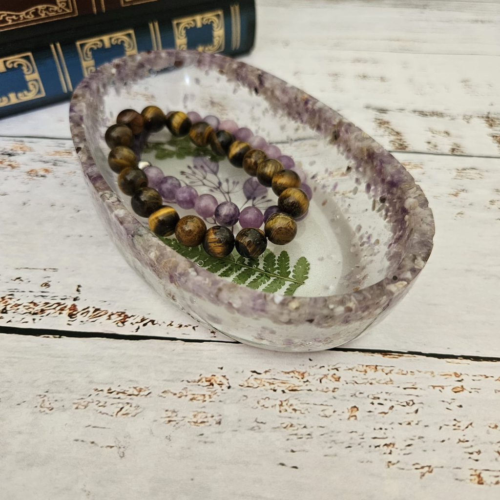 Handmade resin trinket bowl with amethyst crystal chips, pressed fern and crystal bracelets