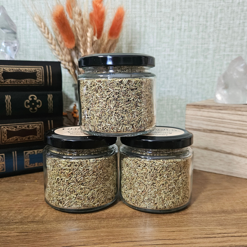 Reusable glass apothecary jars filled with dried rosemary