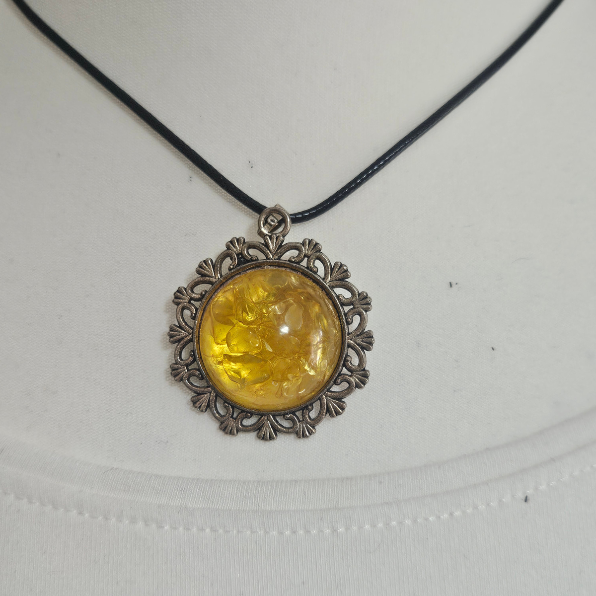 Handmade Citrine crystal chip pendant necklaces set in resin within decorative metal bezels in a choice of designs.