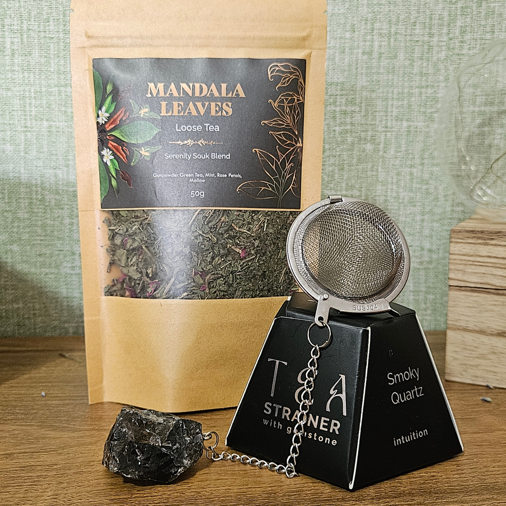 Serenity Soul loose-leaf herbal tea with stainless steel tea infuser and natural Smoky Quartz crystal charm.