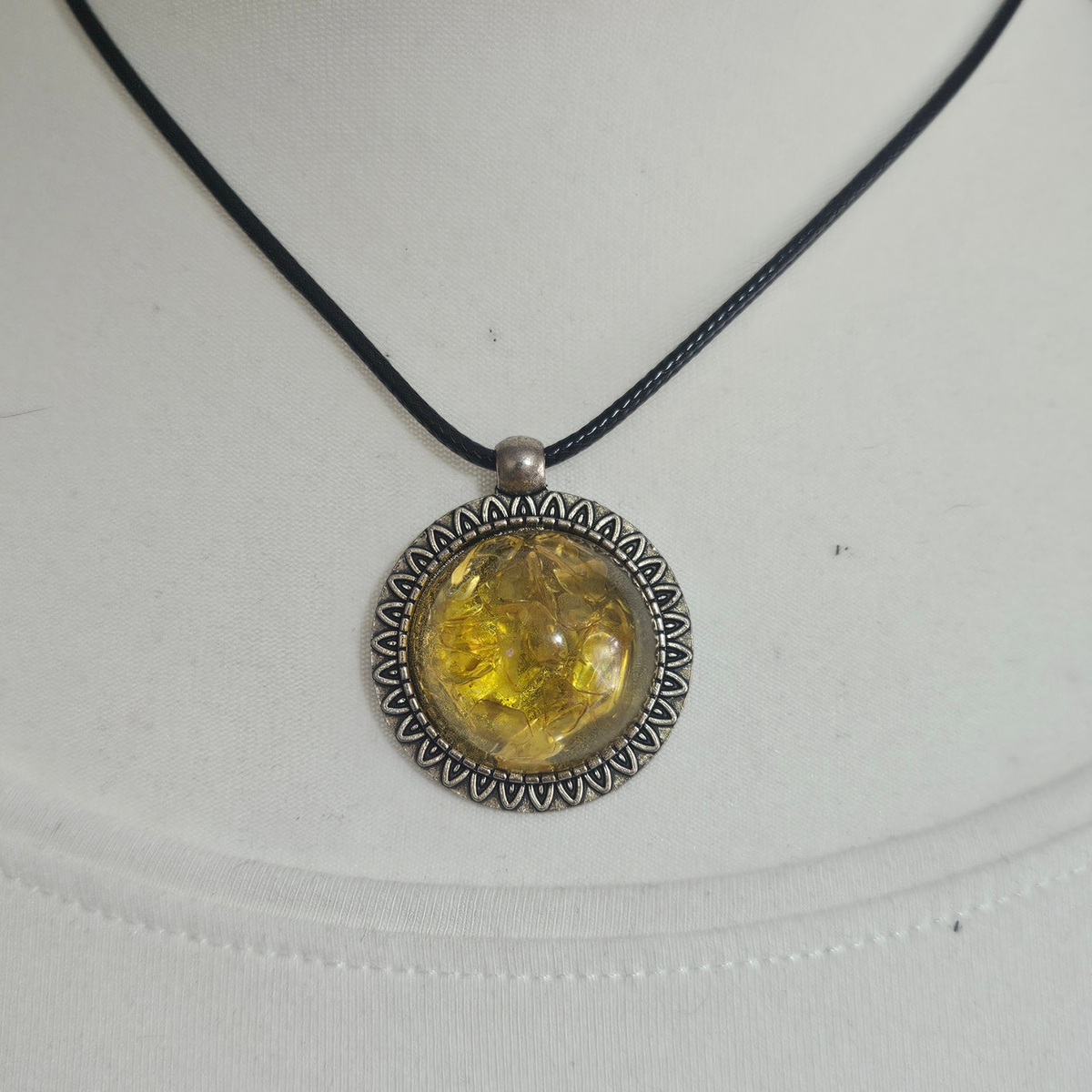 Handmade Citrine crystal chip pendant necklaces set in resin within decorative metal bezels in a choice of designs.