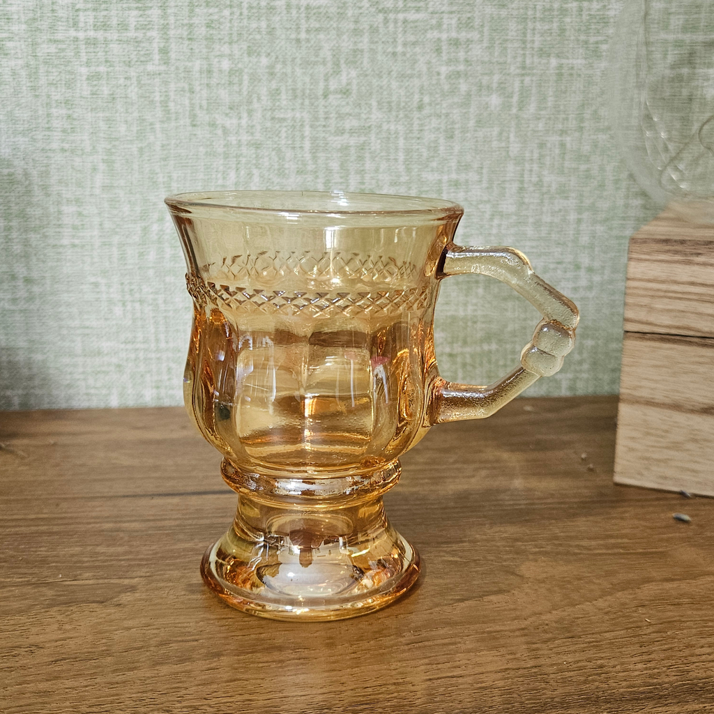 Translucent smoky brown glass mug with handle, suitable for tea, coffee and hot drinks.