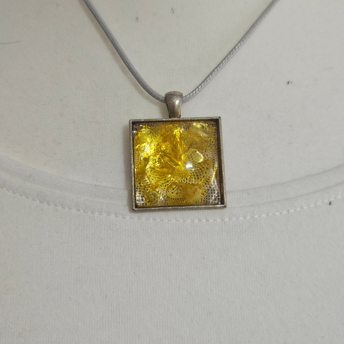 Handmade Citrine crystal chip pendant necklaces set in resin within decorative metal bezels in a choice of designs.