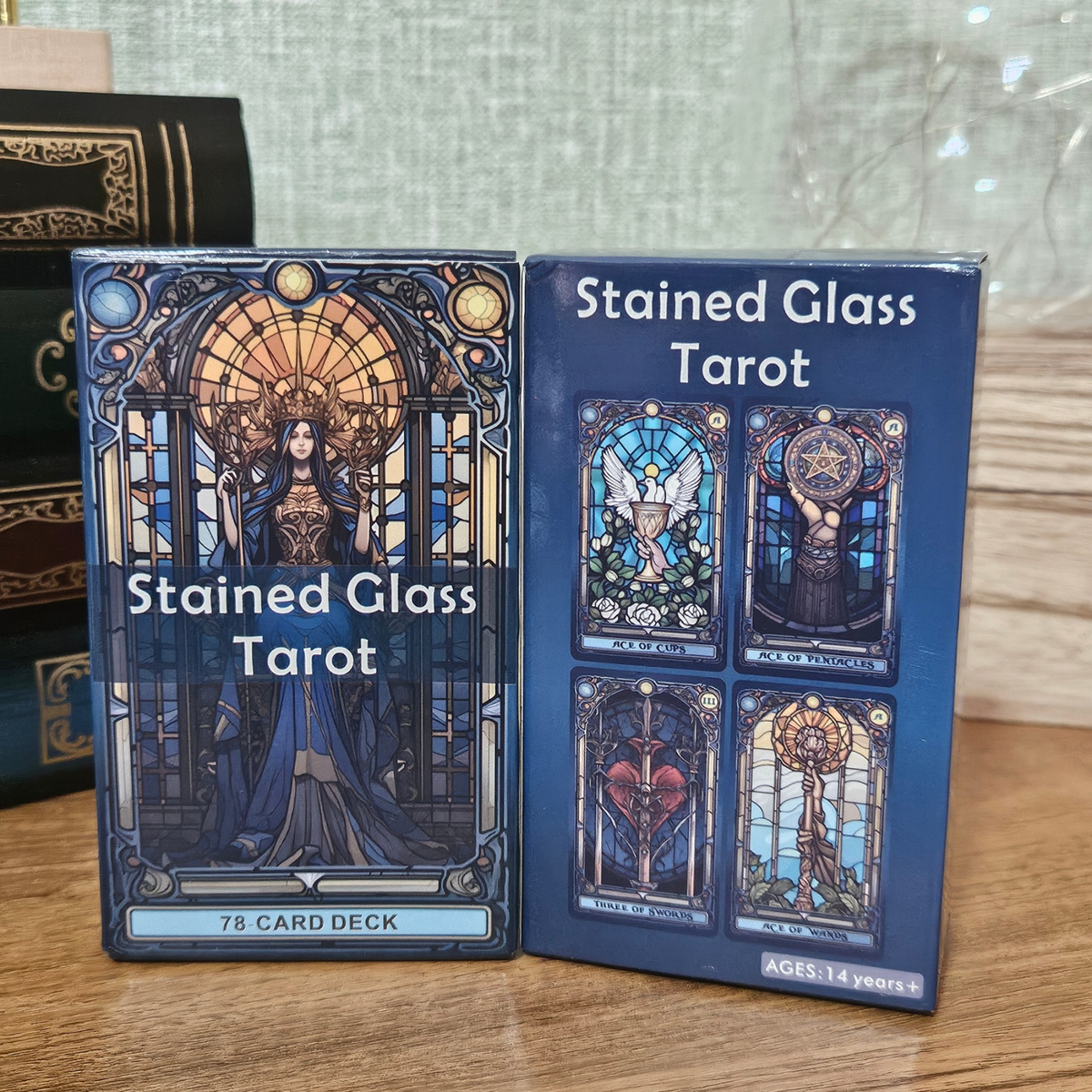 Stained Glass Tarot 78-card deck with blue, gold and jewel-toned mystical stained glass artwork.